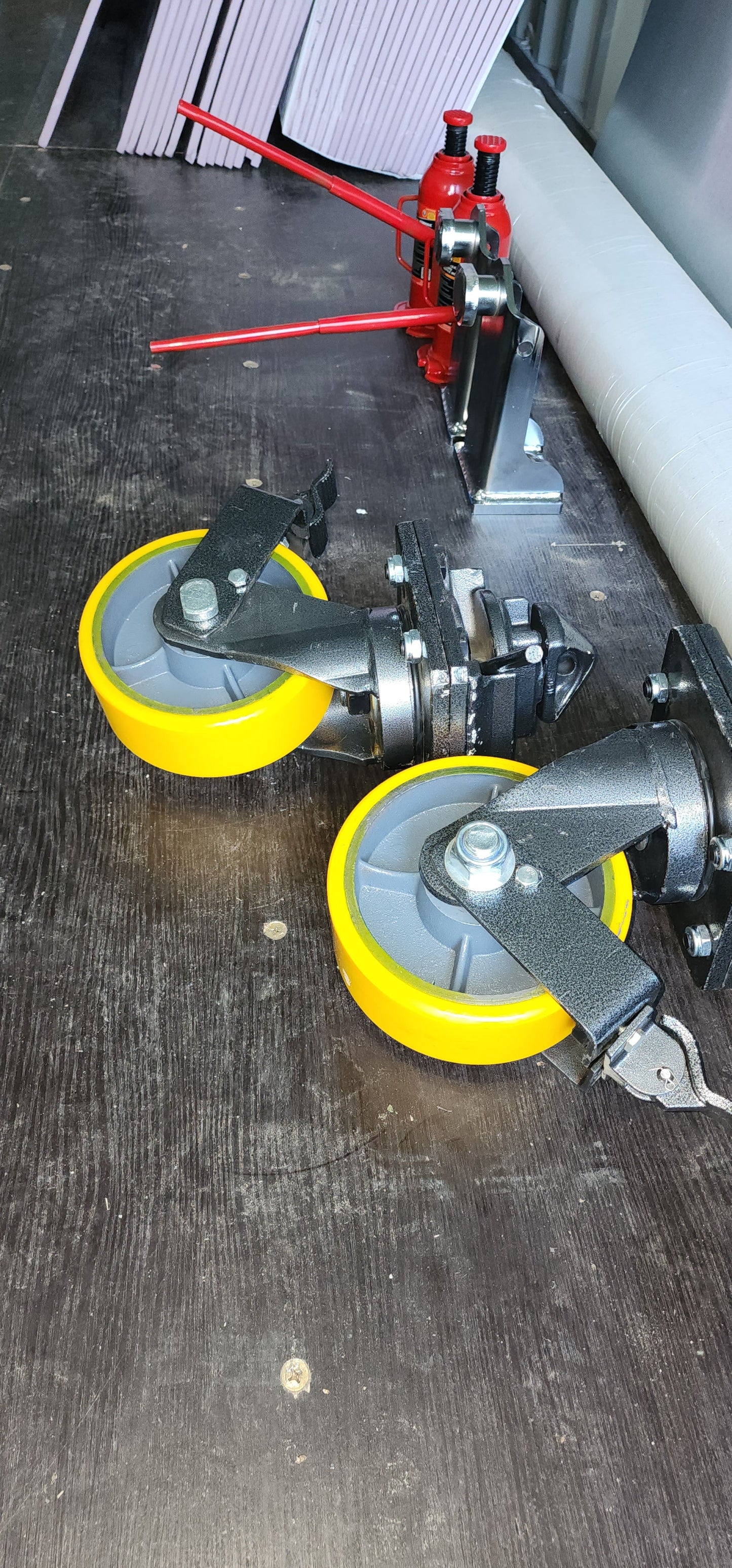 Casters 2 Pair = These will allow you to move the unit in any direction on pavement or concrete.